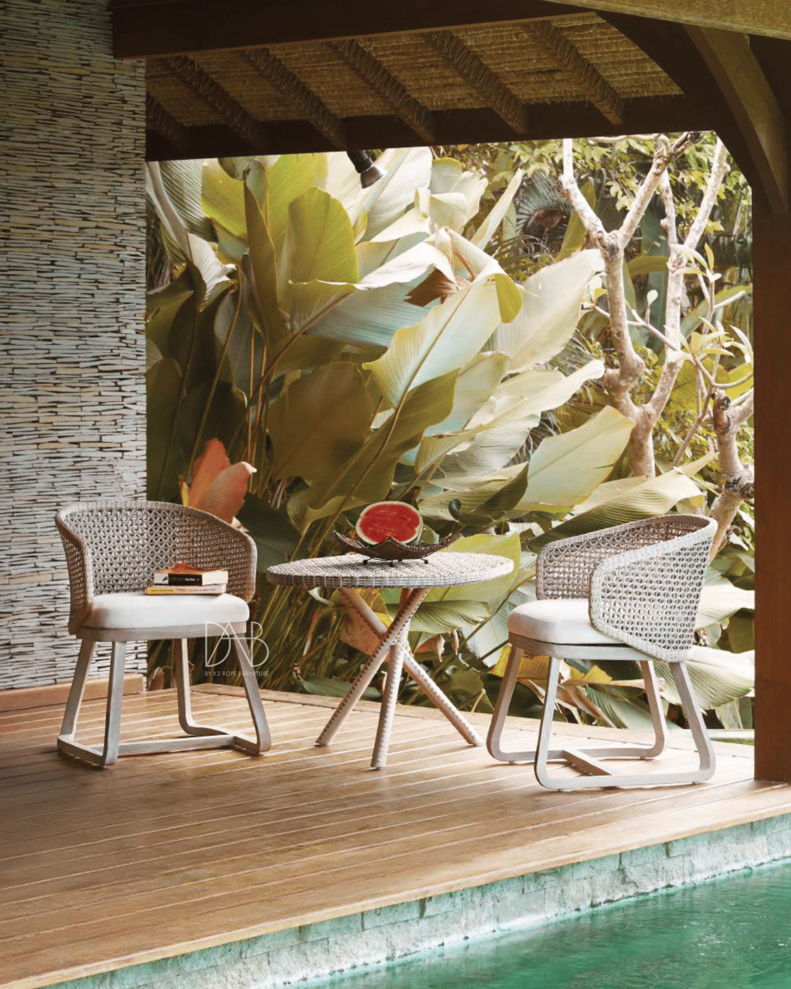 Stylish outdoor dining set with rope chairs.