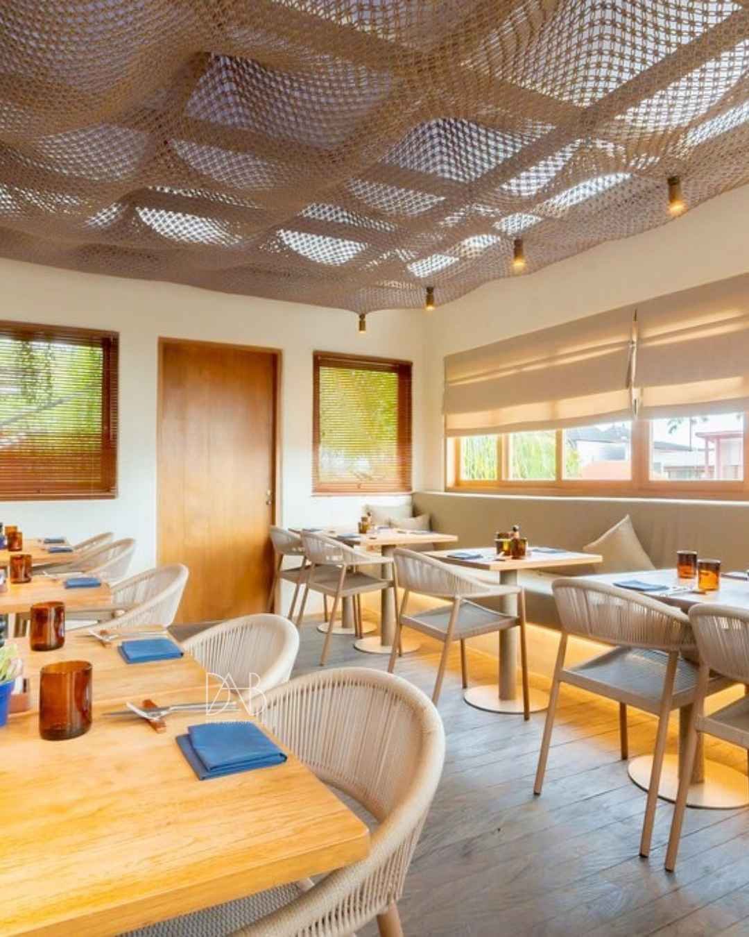 Sleek modern restaurant furniture arrangement.